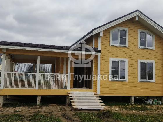 Двухэтажная баня с террасой 7х11 из бруса